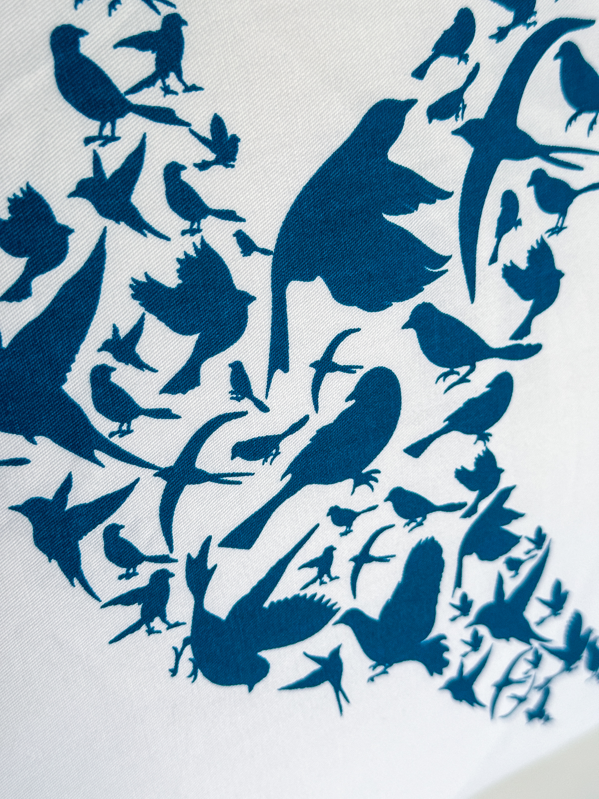close up view of screen printed bird design