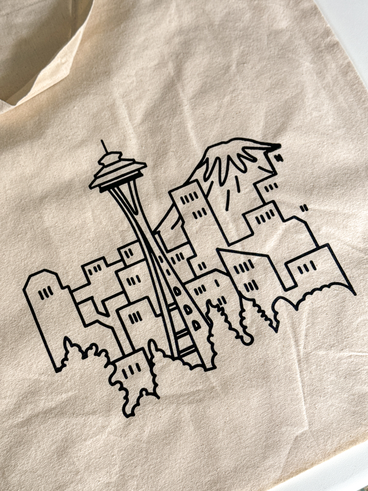 DIY screen printed tote bag with line drawing of the Space Needle and Mt. Rainier