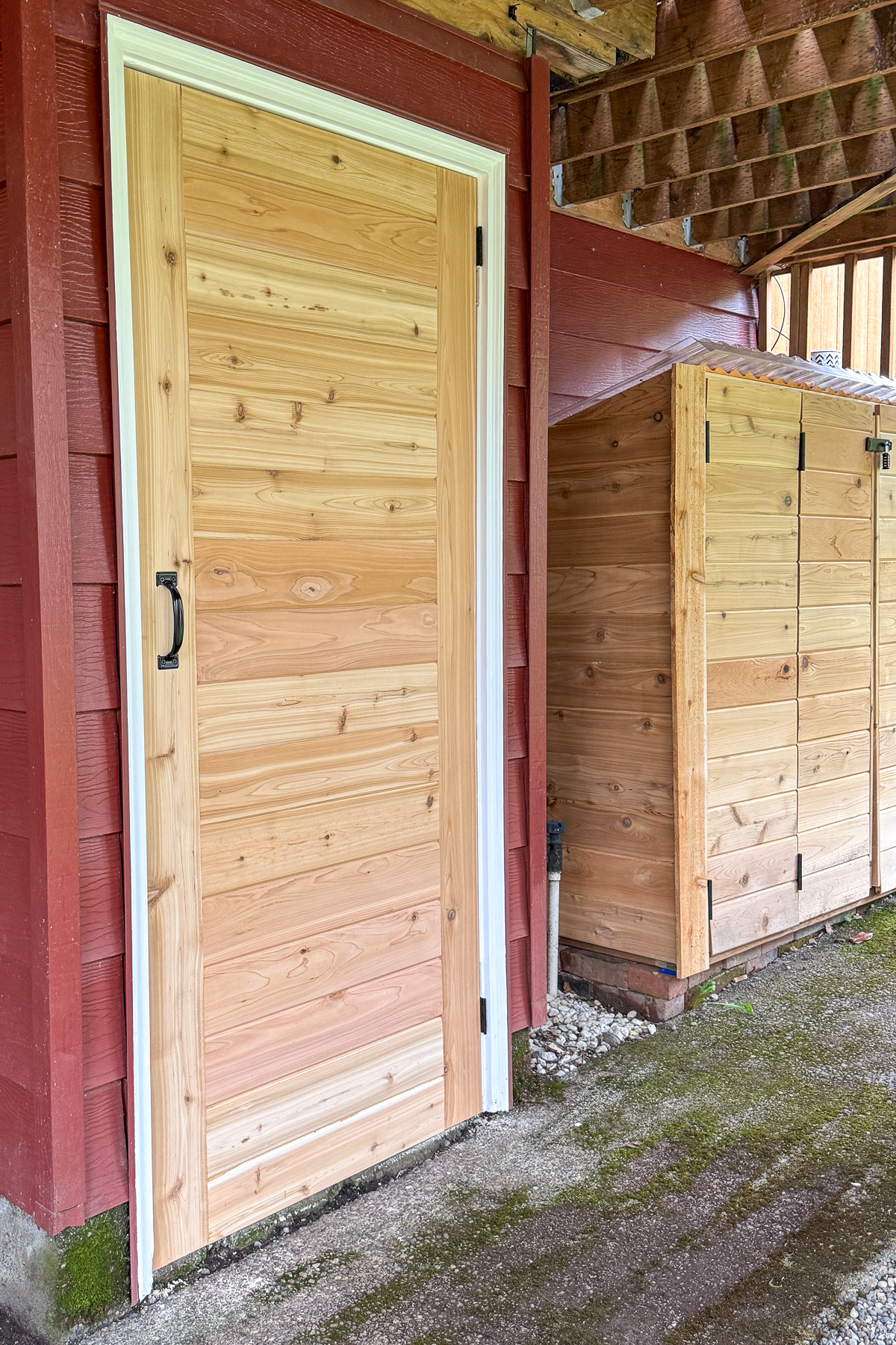 garden shed next to bike shed with matching cedar doors