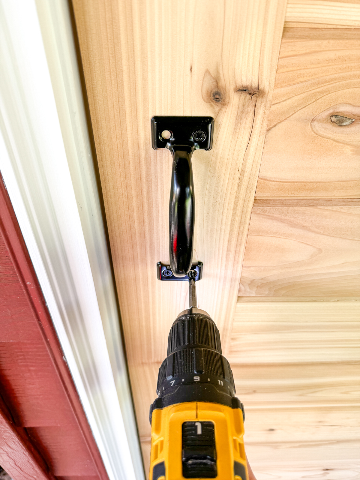installing a door handle on the shed door