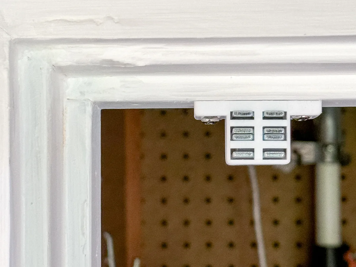 magnetic catch at the top of the door frame to hold the shed door closed