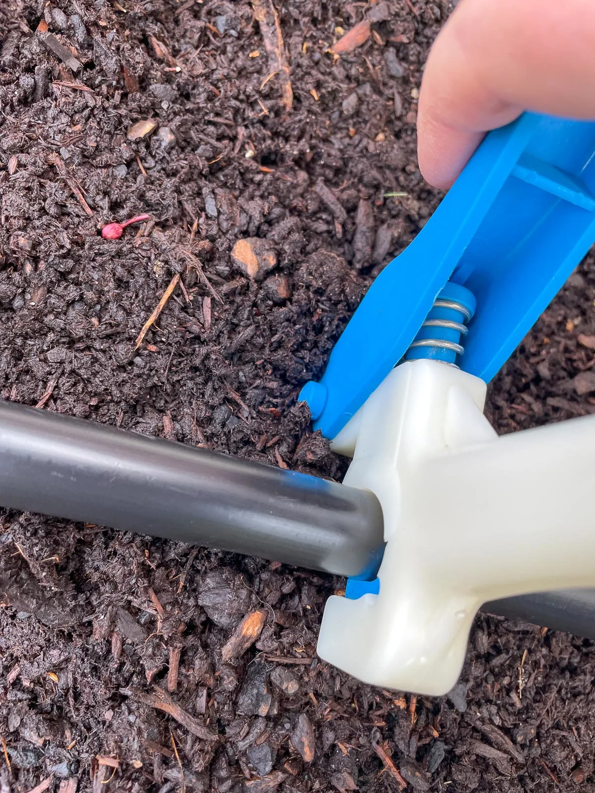 punching holes in ½" drip irrigation supply line for ¼" connectors