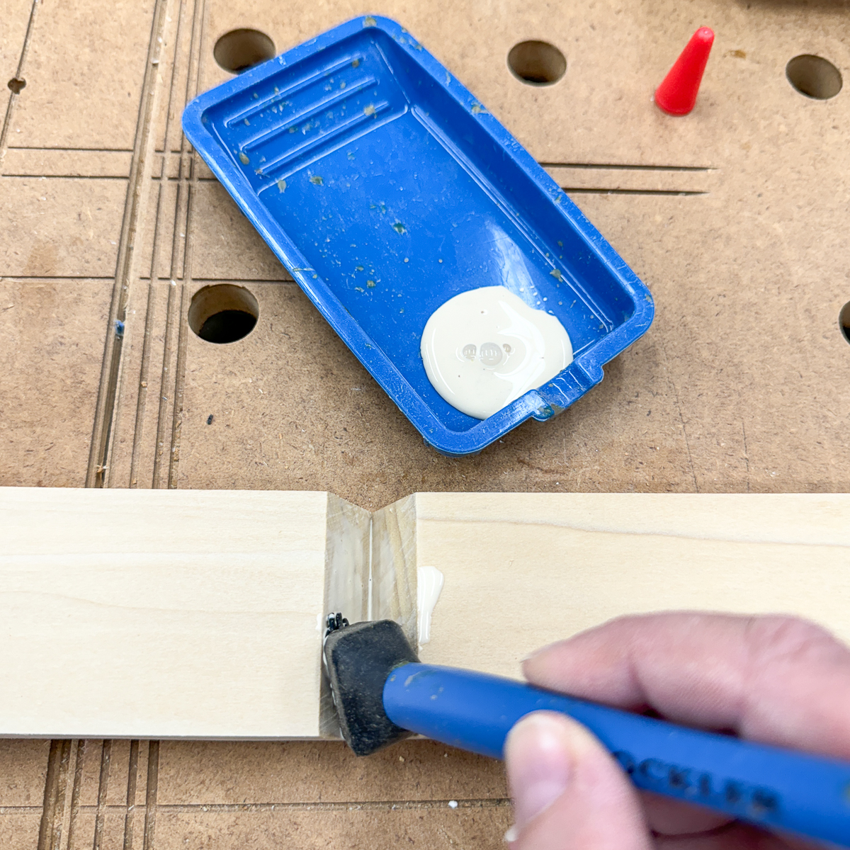 applying wood glue to joints before assembly