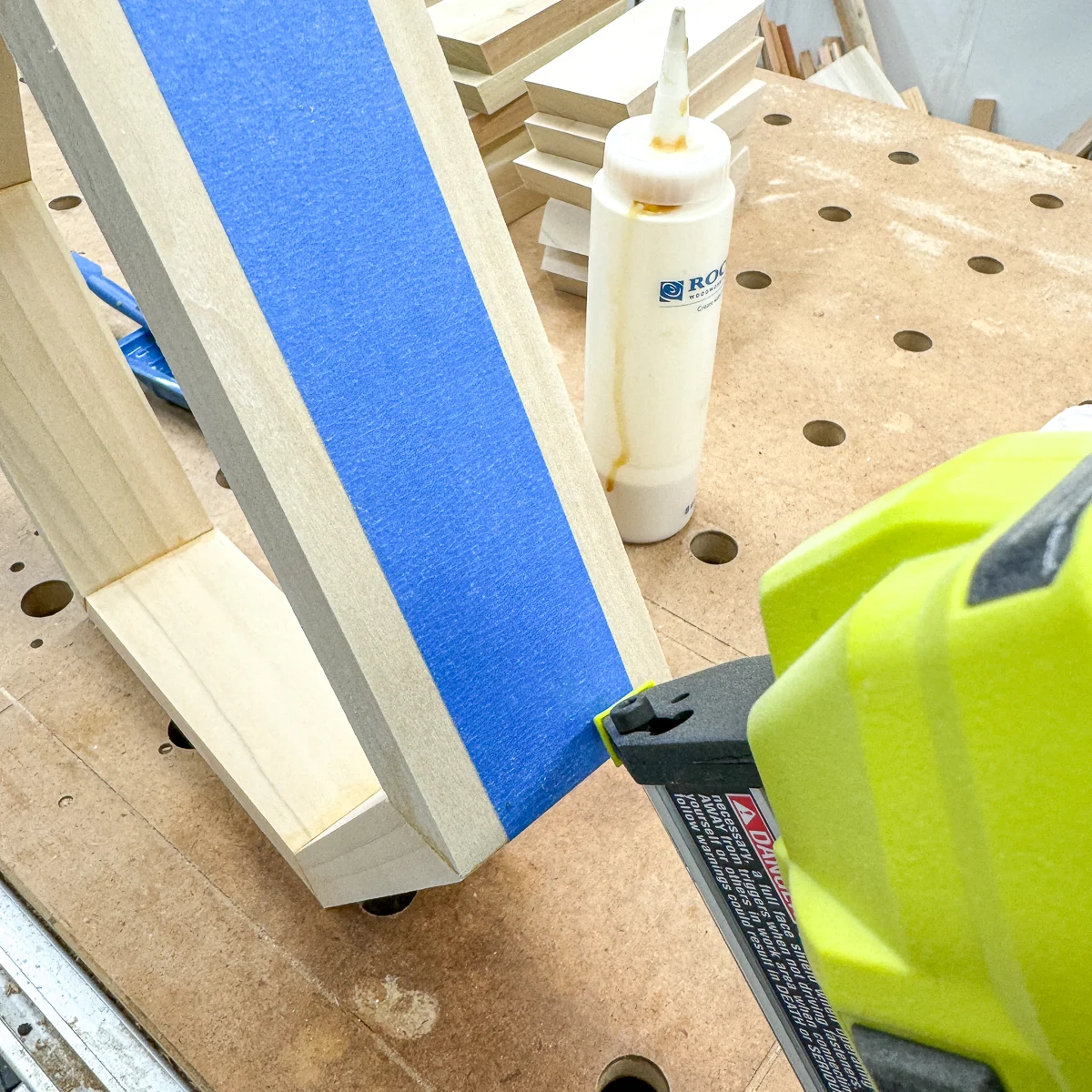 using a pin nailer to hold the hexagon shelf corners together