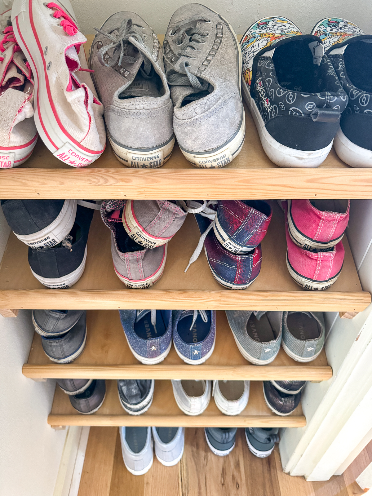 DIY slanted shoe shelves in small closet