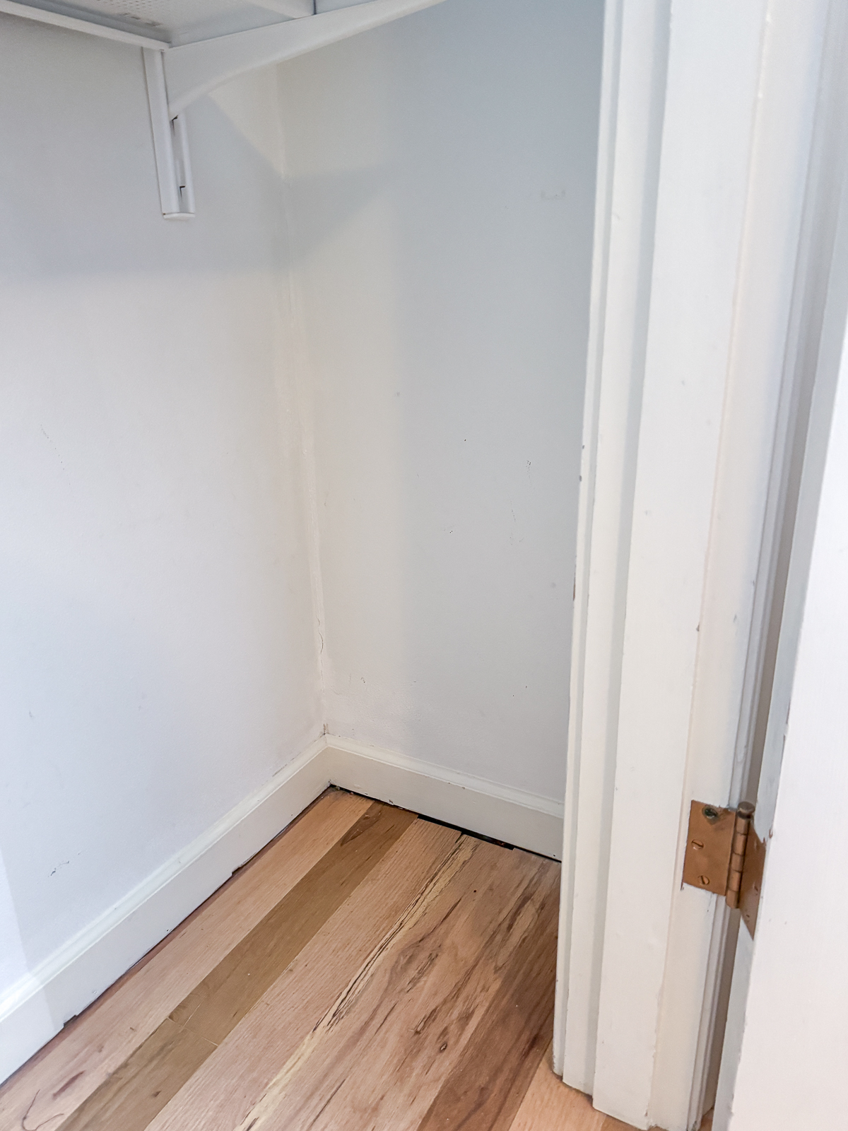 empty closet before installing shoe shelves