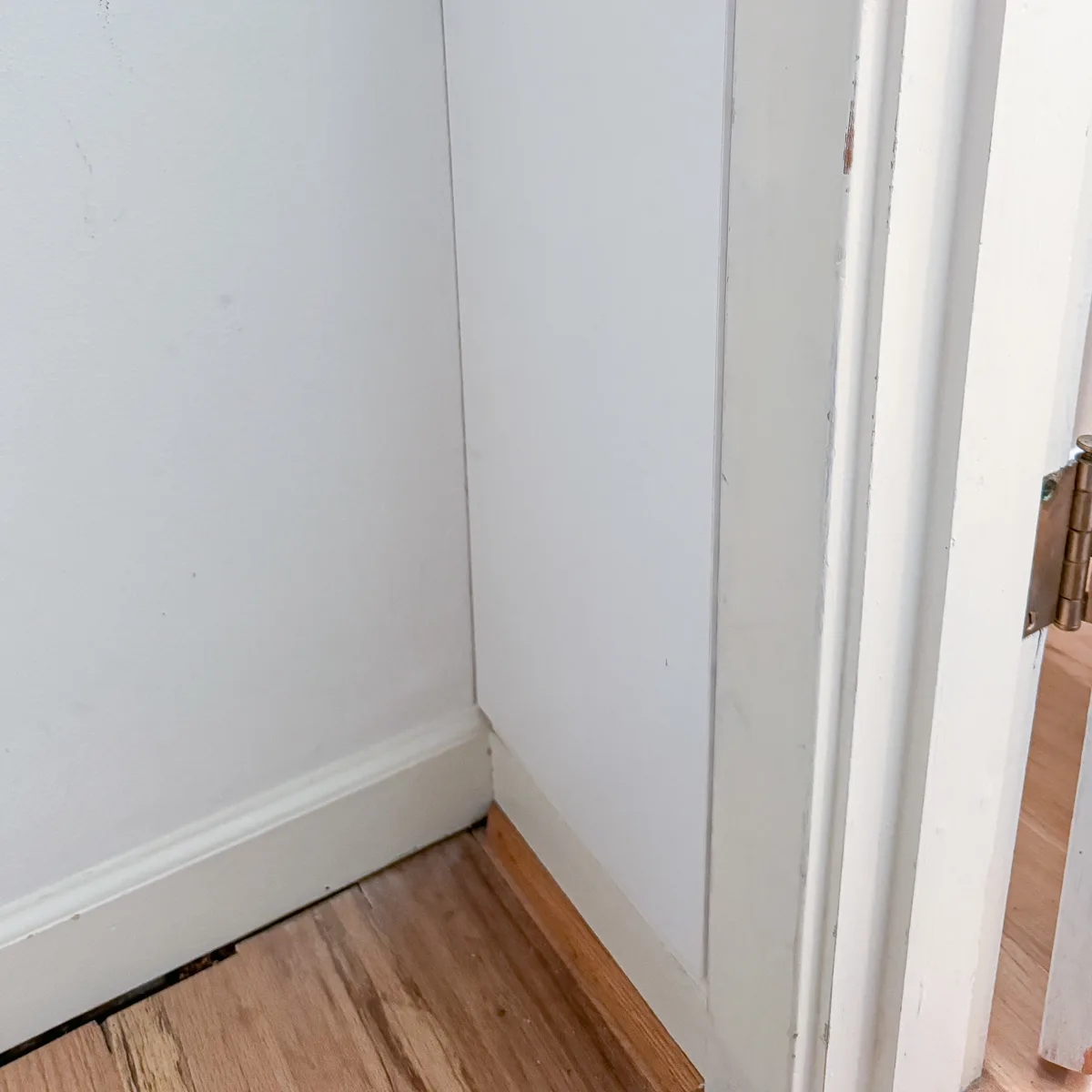 adding a filler board at the same thickness of the door trim inside the closet