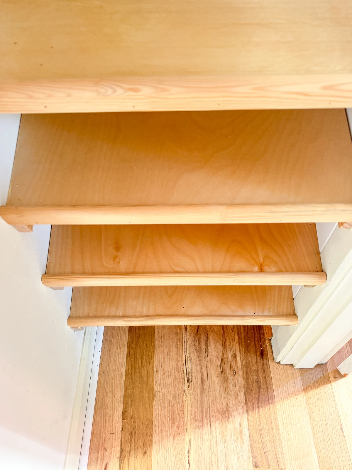 slanted shoe shelves in closet