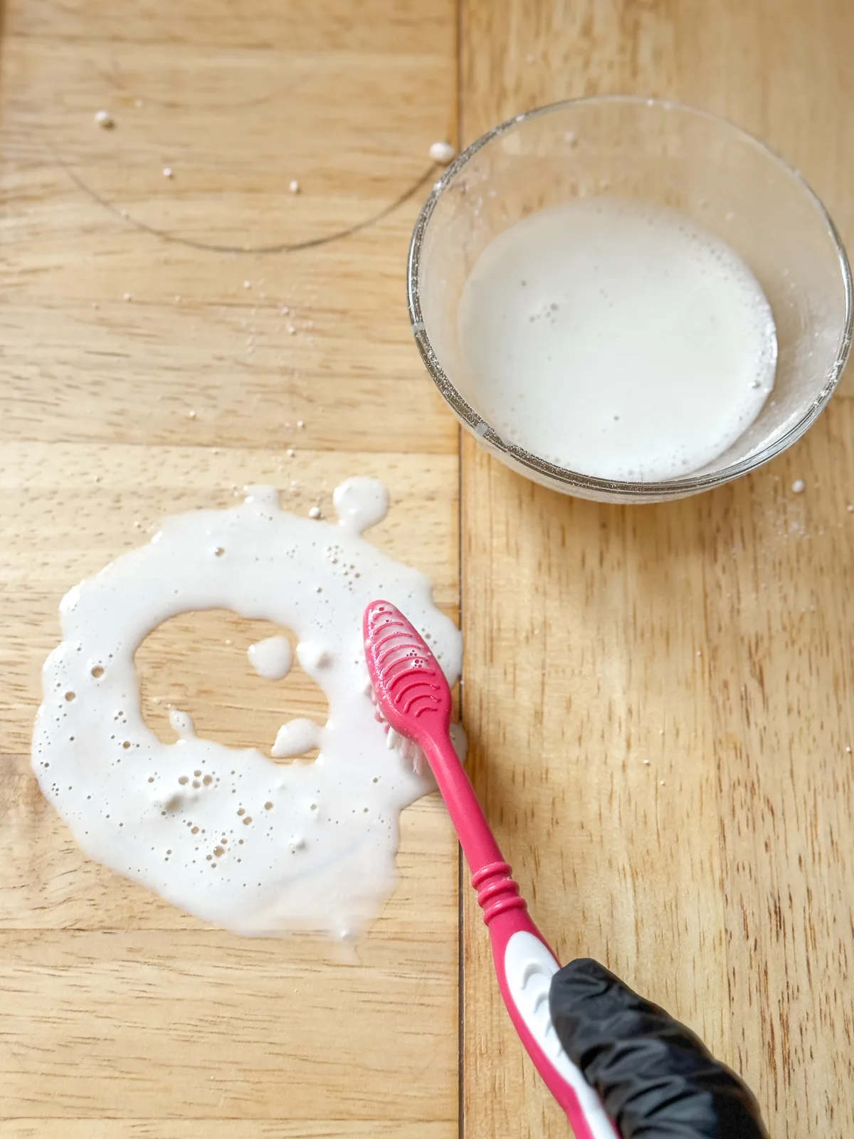 applying oxalic acid to black rust stain on wood countertop