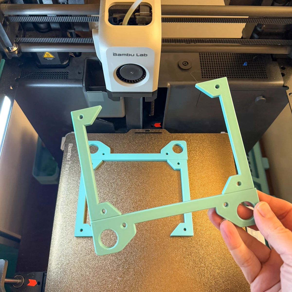 filament storage rack brackets on 3d printer plate