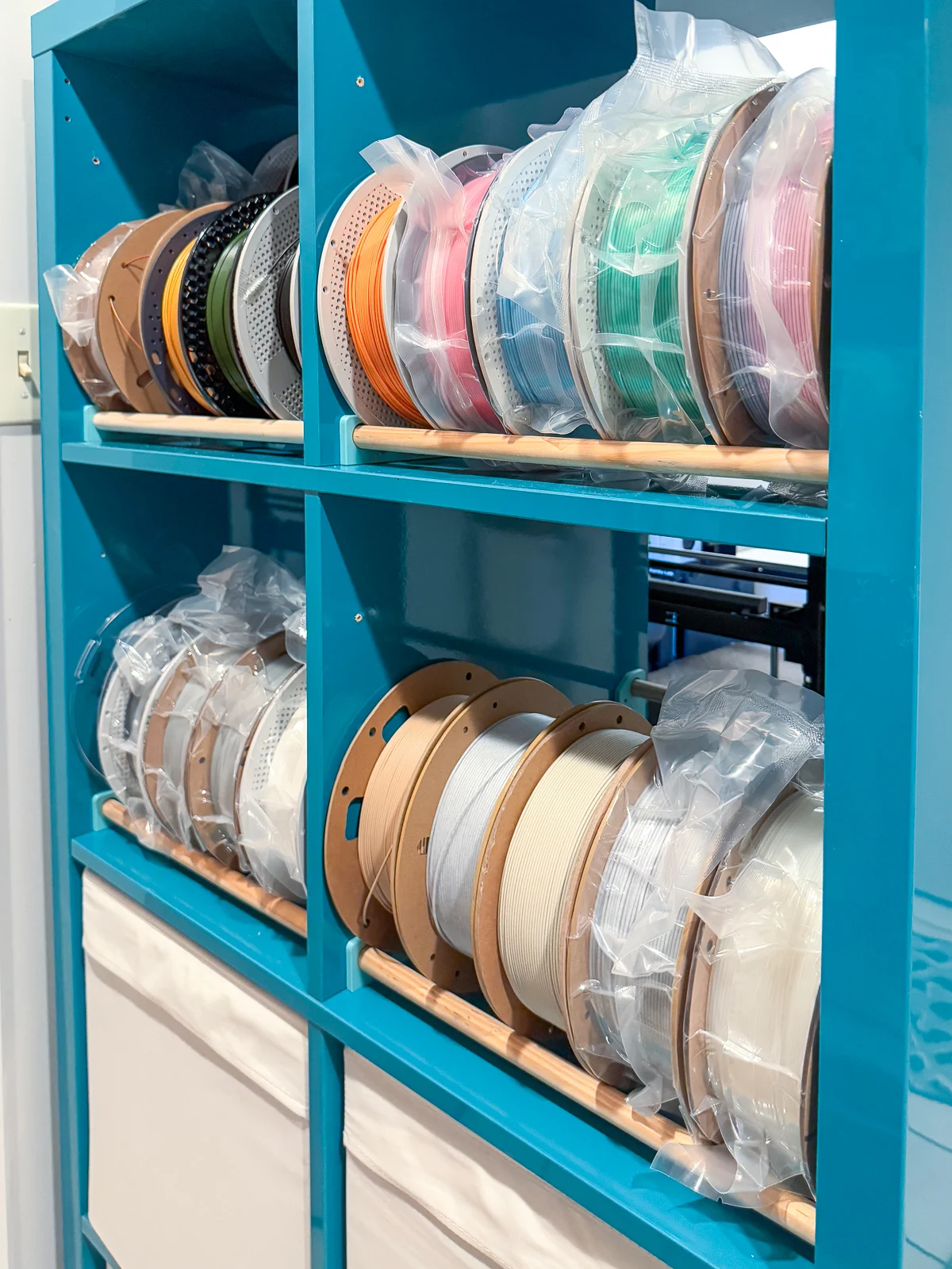 3d printer filament storage racks in blue IKEA Kallax shelving unit